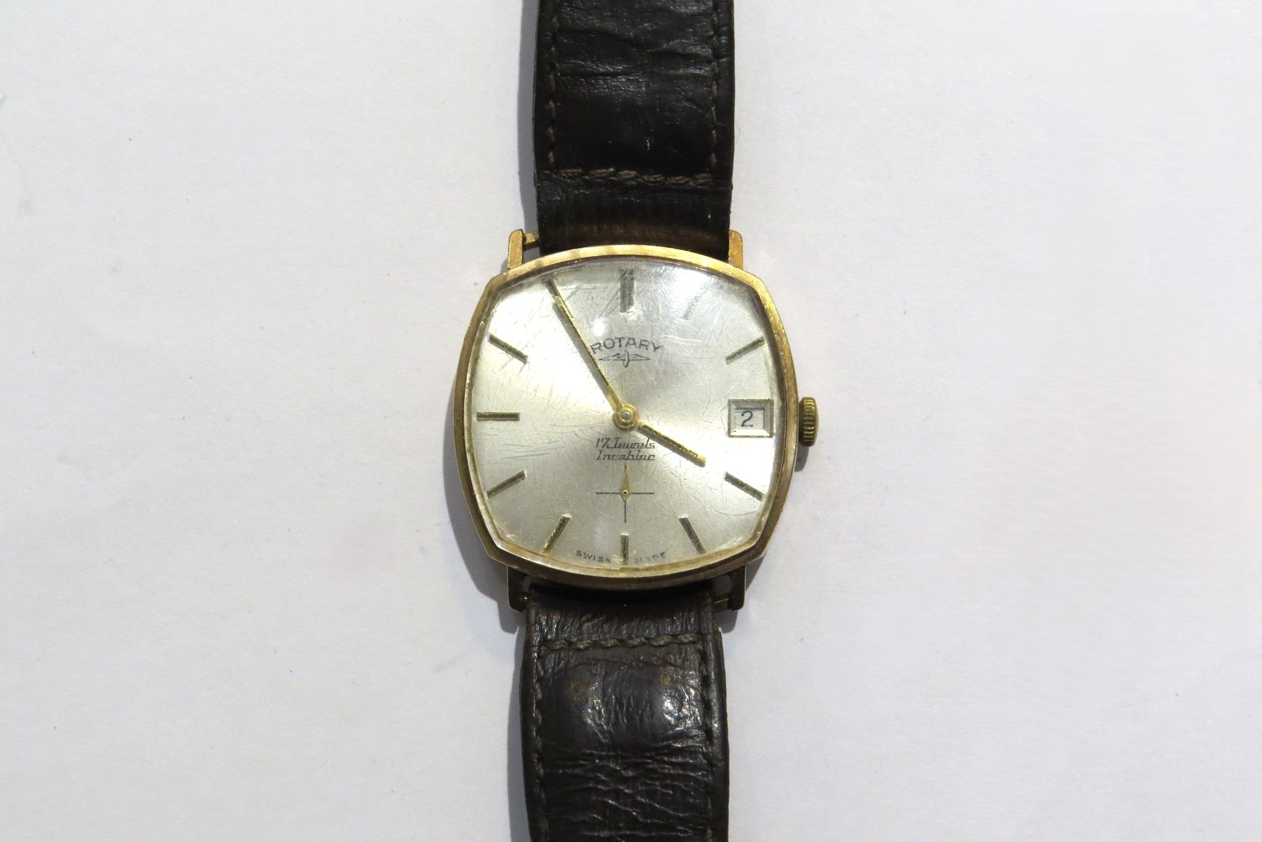 A 9ct gold Rotary 17 jewel Incabloc manual wind wristwatch with worn leather strap
