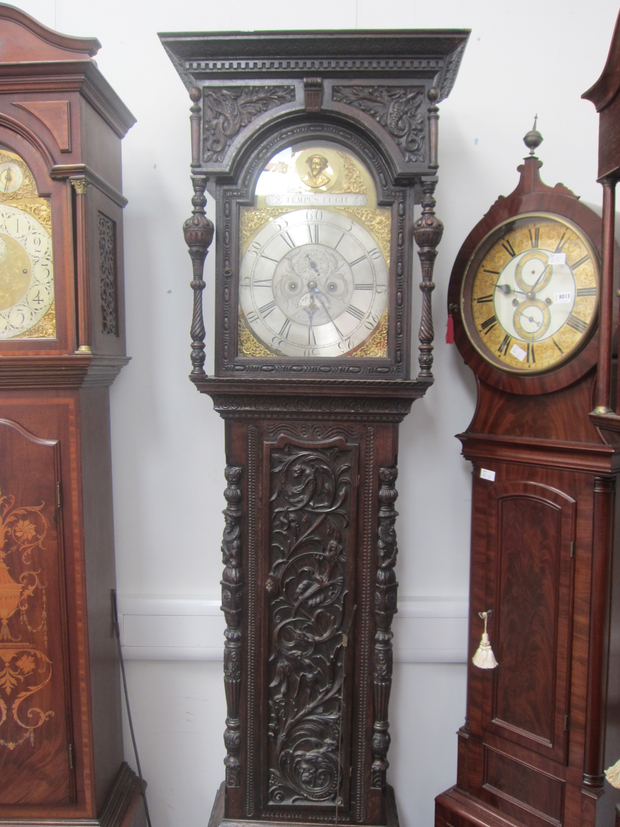 An 18th Century heavily carved oak longcase clock with silvered Roman chapter ring, date and seconds - Image 3 of 8