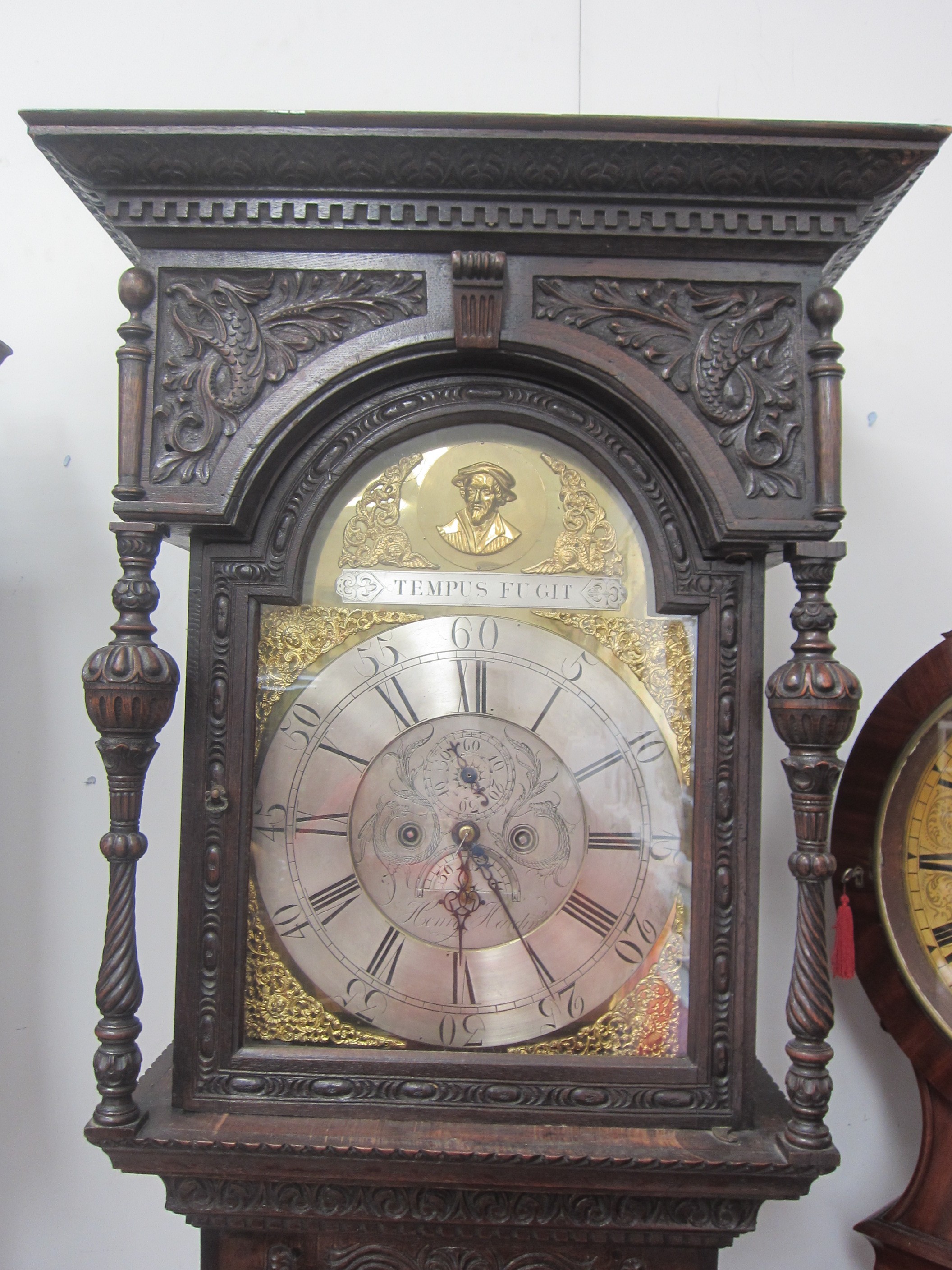 An 18th Century heavily carved oak longcase clock with silvered Roman chapter ring, date and seconds - Image 2 of 8