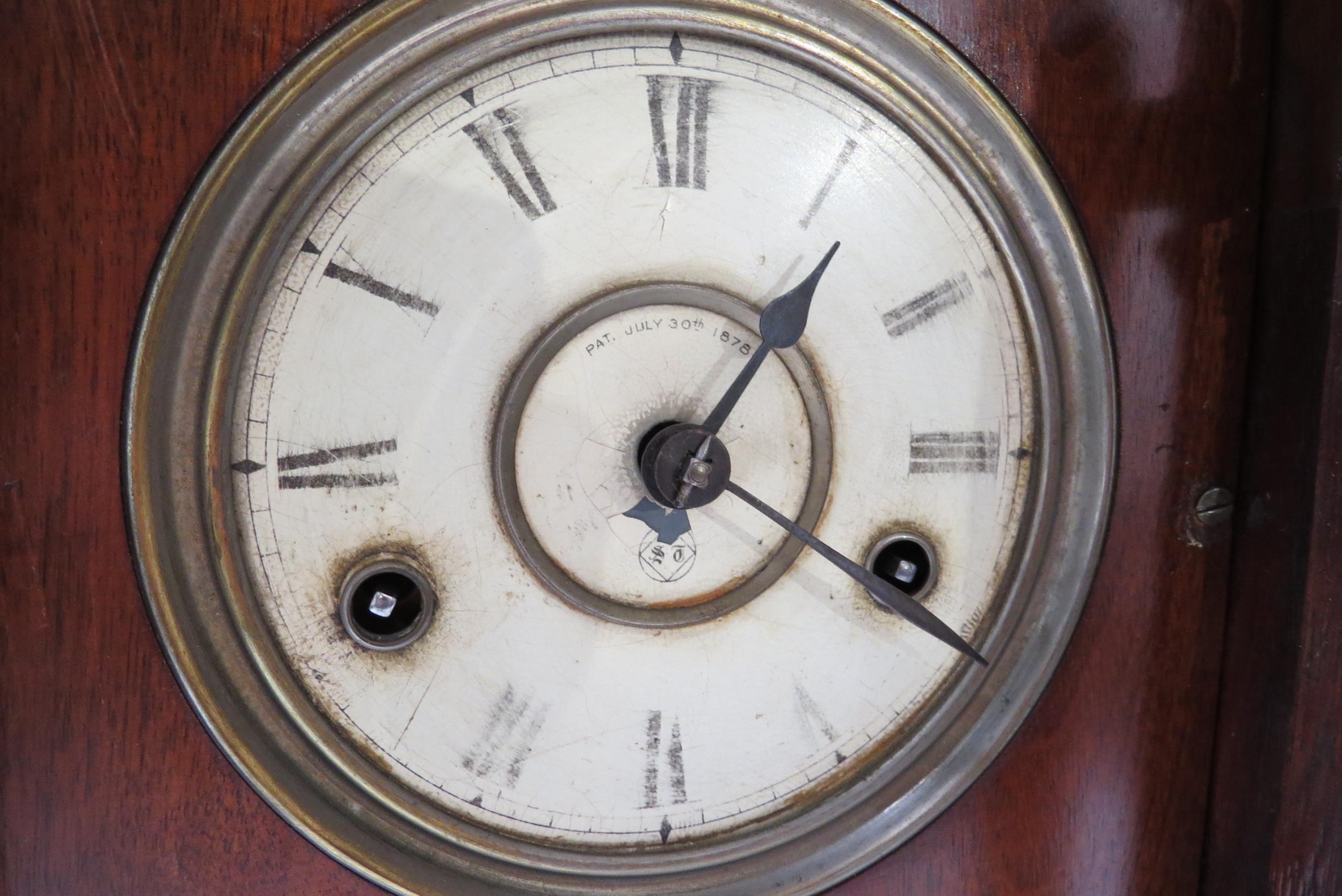 A late Victorian cottage clock, Roman numeral dial, Pat. July 30th 1878 to face, worn. 39cm high - Image 2 of 2