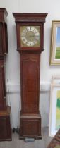 An 18th Century 30-hour longcase clock in oak case. Brass 11" dial with mask spandrels and Roman