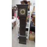 An early 20th Century oak cased striking and chiming grandmother clock. With pendulum and key.