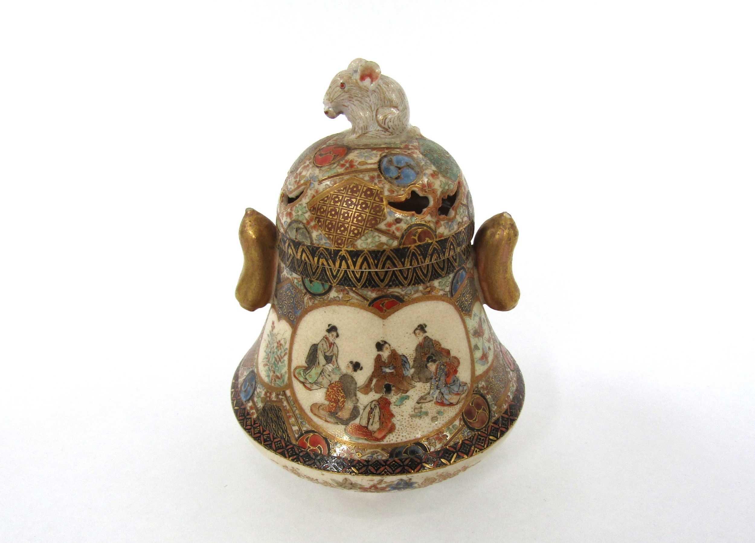 A Japanese satsuma lidded pot. The lid surmounted by a rat, the base decorated with landscape and