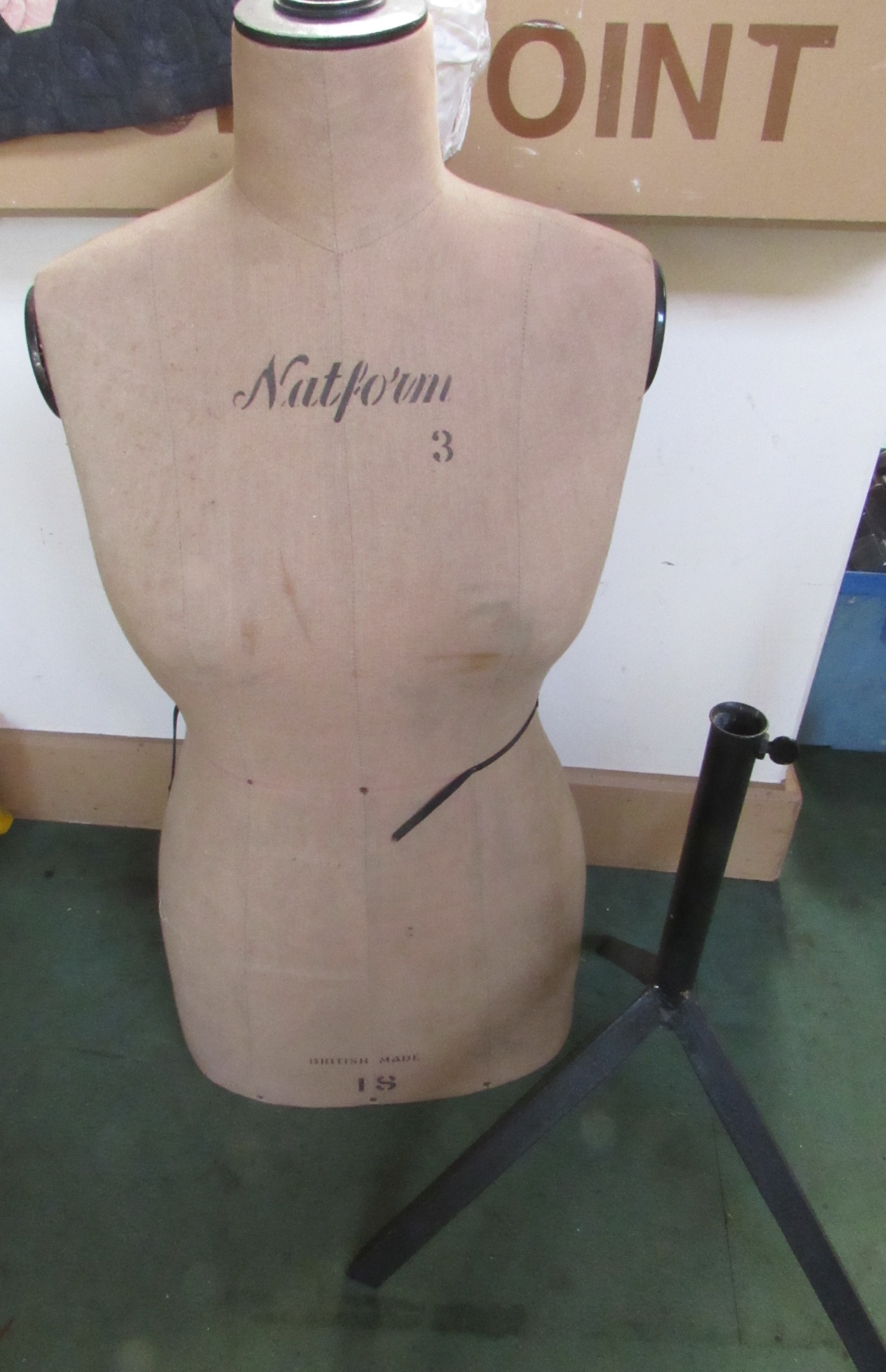 A Natform 3 linen clad female mannequin with stand, missing pole