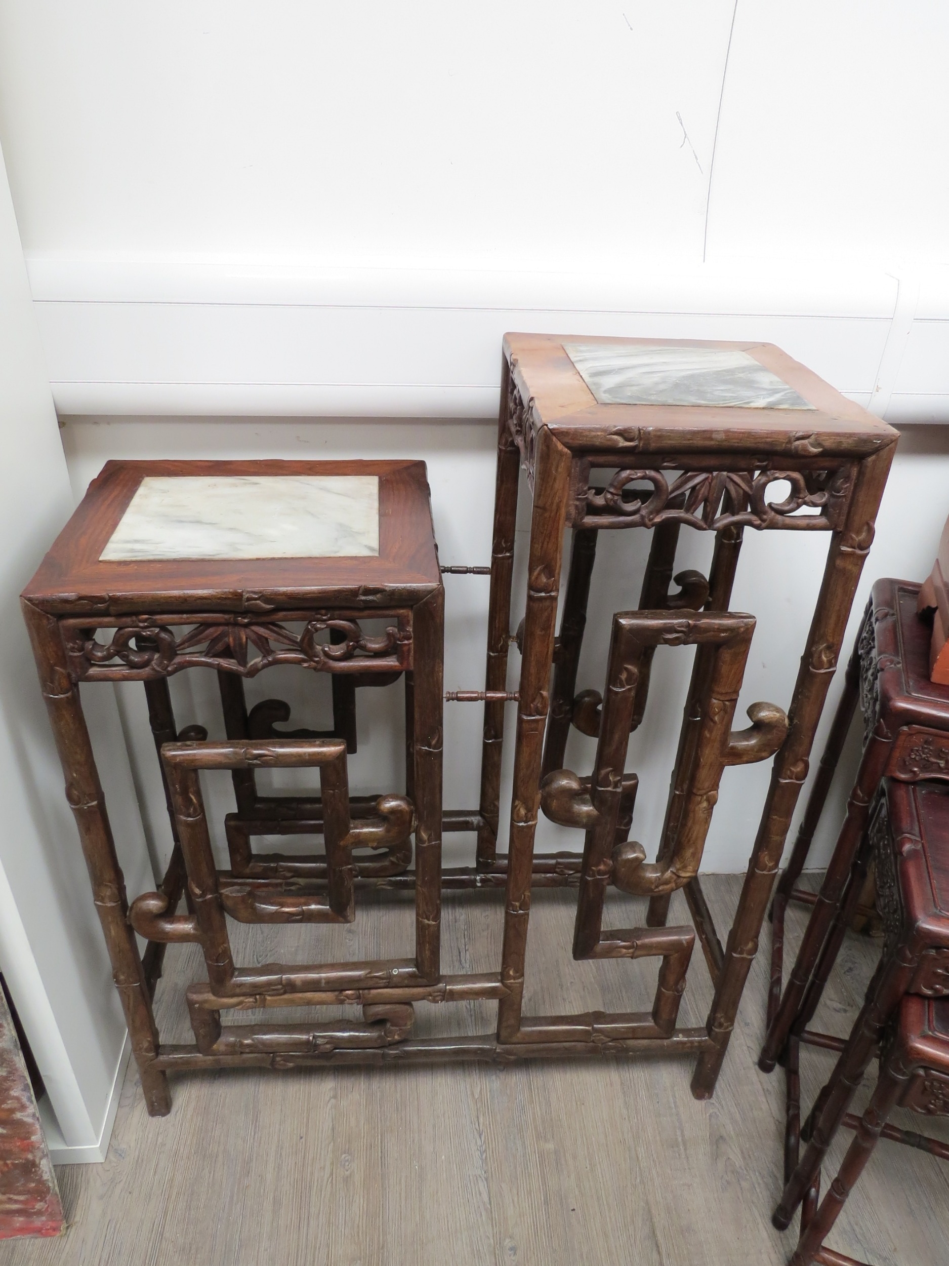 A Chinese hardwood two tier plant stand with marble inlay to top, 94cm at tallest x 75cm x 31cm