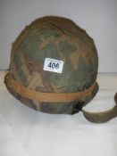 A United States army Vietnam era helmet.