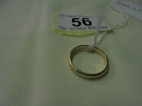 An un-marked wedding ring, size M, 1.9 grams.