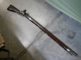 A early Brown Bess musket, complete including hammer mechanism but woodwork needs serious repairs.