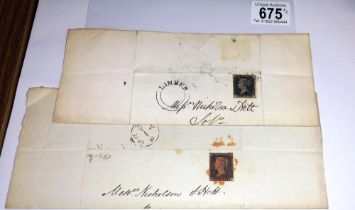 Two mid 19th century penny black postage stamps on postmarked envelopes.