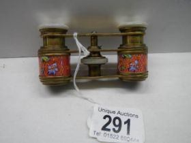 A superb quality pair of enameled opera glasses.