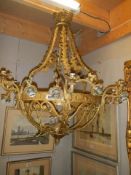 A large heavy brass chandelier, COLLECT ONLY.
