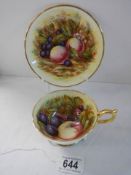 An Aynsley Orchard Gold Apricot cup and saucer with gold footing signed D Jones.