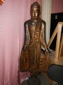 A carved hardwood figure of an Indian Diety, 5'6" tall.