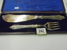 A cased pair of silver plate fish servers.
