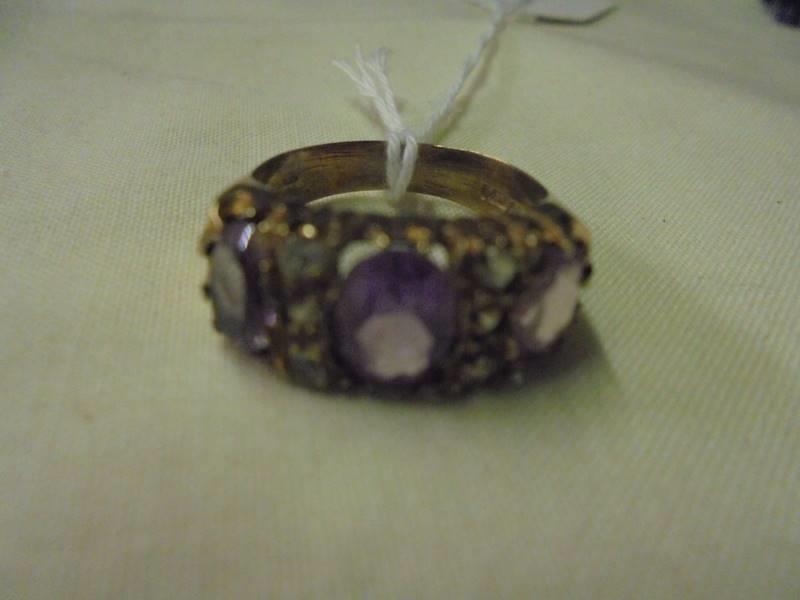 A 9ct gold ring set lilac coloured stones, size P half. (4.5gms) - Image 2 of 3