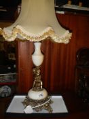 A circa 1950's heavy marble table lamp with gilded cherub figure. COLLECT ONLY.