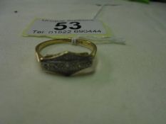 An 18ct gold and platinum ring, size Q, 2.8 grams.