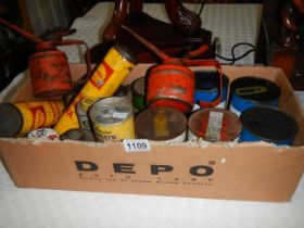 A box of old advertising oil cans. COLLECT ONLY.