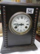 An early 20th century oak cased mantel clock.