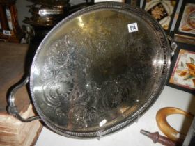 A large silver plate gallery tray by 'Cavalier'. Finely etched & raised on bun feet, good condition.