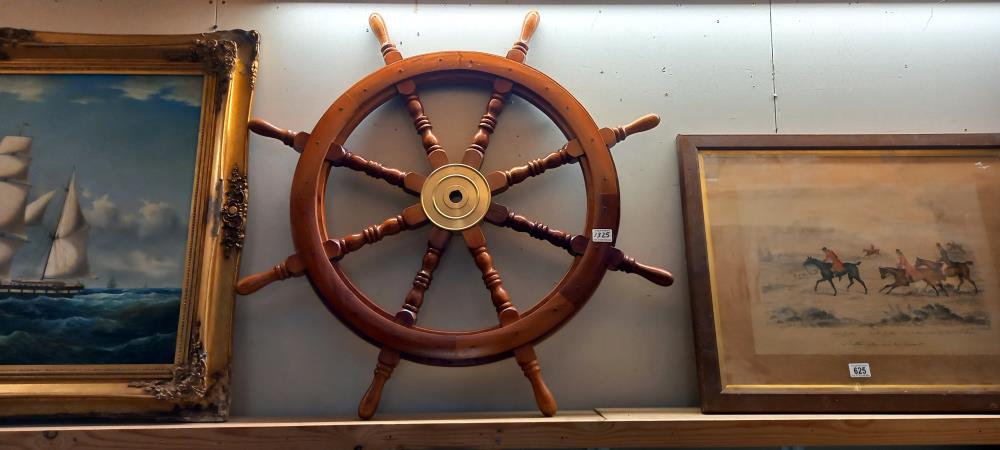 A large hard wood ships/boat wheel with brass hub. Diameter 92cm COLLECT ONLY
