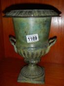 A 20th century verdigree brass urn.