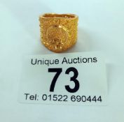 An ornate 22ct gold ladies ring, size N, 7 grams.