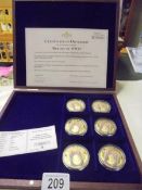 A cased set of Heroes of WW2 gold plated coins with certificate.