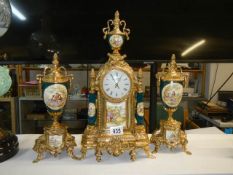 A three piece clock garniture.