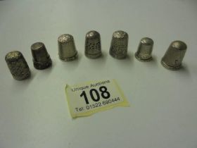 Seven silver thimbles. 1.2 oz.