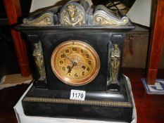 An old slate mantel clock in working order. COLLECT ONLY.