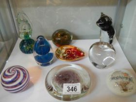 A mixed lot of glass paperweights etc.,