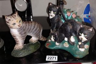 2 cast iron cat door stops