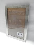 A silver photo frame, 20.5 x 14.5 cm.