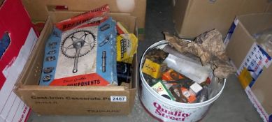 A box and tin of various cycle parts etc