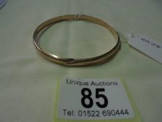 A 9ct gold slave bracelet (has small dent), 6.5 grams.