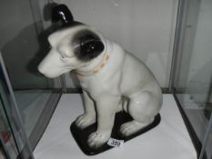 A HMV Nipper dog figure.