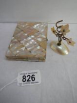 A mother of pearl side opening card case and a small mother of pearl pen holder.
