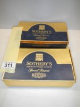 Two boxes of Sotheby's matches, 10 packs in each box and all complete and unused.