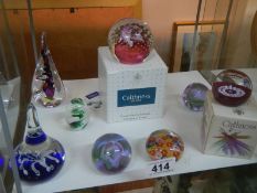A good lot of glass paperweights including Caithness.