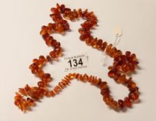 An amber necklace, 55 grams.