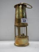 A 20th century brass miner's lamp.