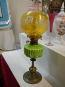 An Early 20th century oil lamp with glass font and shade. COLLECT ONLY.