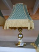 A good quality brass table lamp with fringed shade.