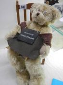 A Grandad bear on a chair.