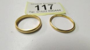 Two 22ct gold wedding ring, sizes O and P, 5.8 grams.