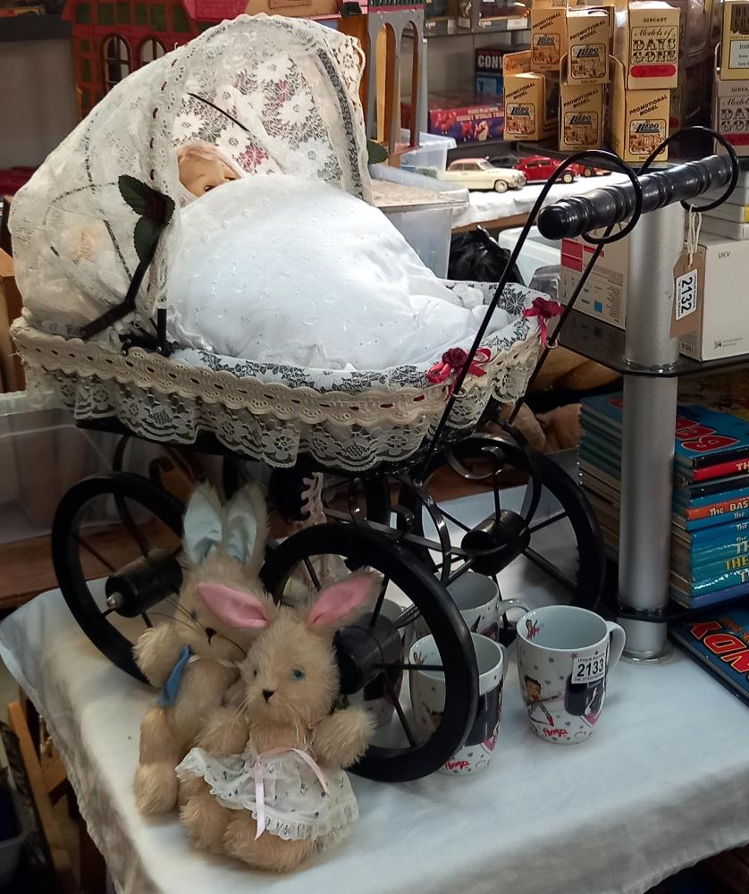 A Victorian style dolls pram with two dolls and 2 small rabbits, COLLECT ONLY.