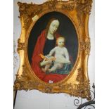 A gilt framed oval oil on canvas painting of Madonna with child, frame 104 x 85 cm, image 78 x 57 cm