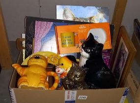 A box of cat items including pictures, etc