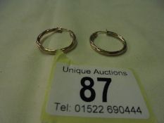 A pair of 9ct gold twist earrings, 1 gram.